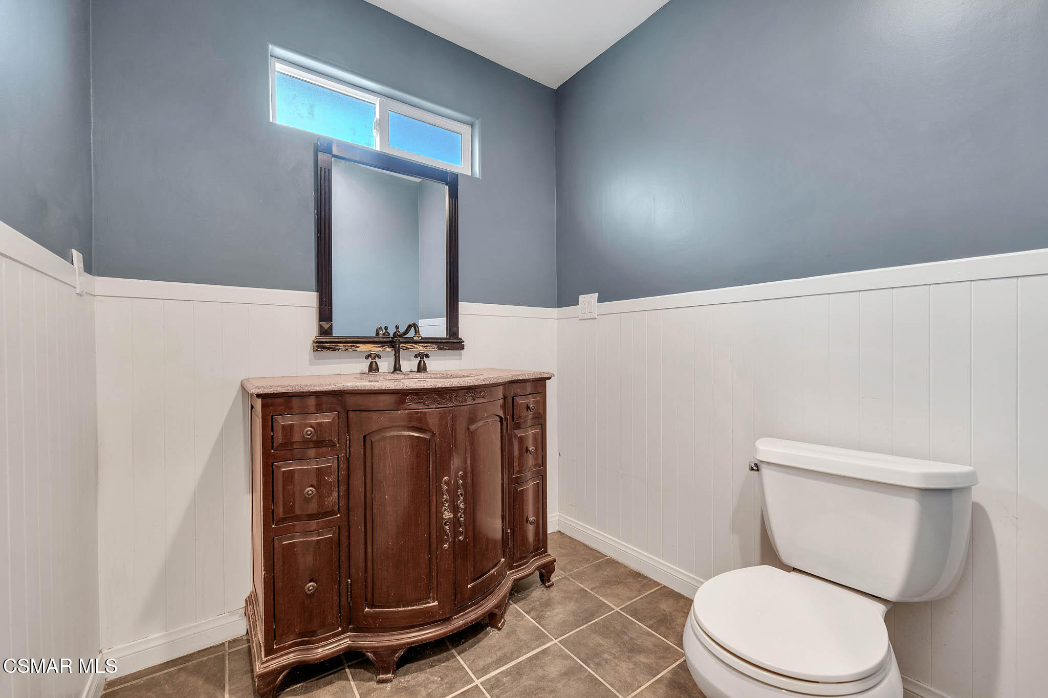 3063 Ditch Road Simi Valley, CA 93063 - Photo 18 of 49 a bathroom with a toilet a sink and mirror