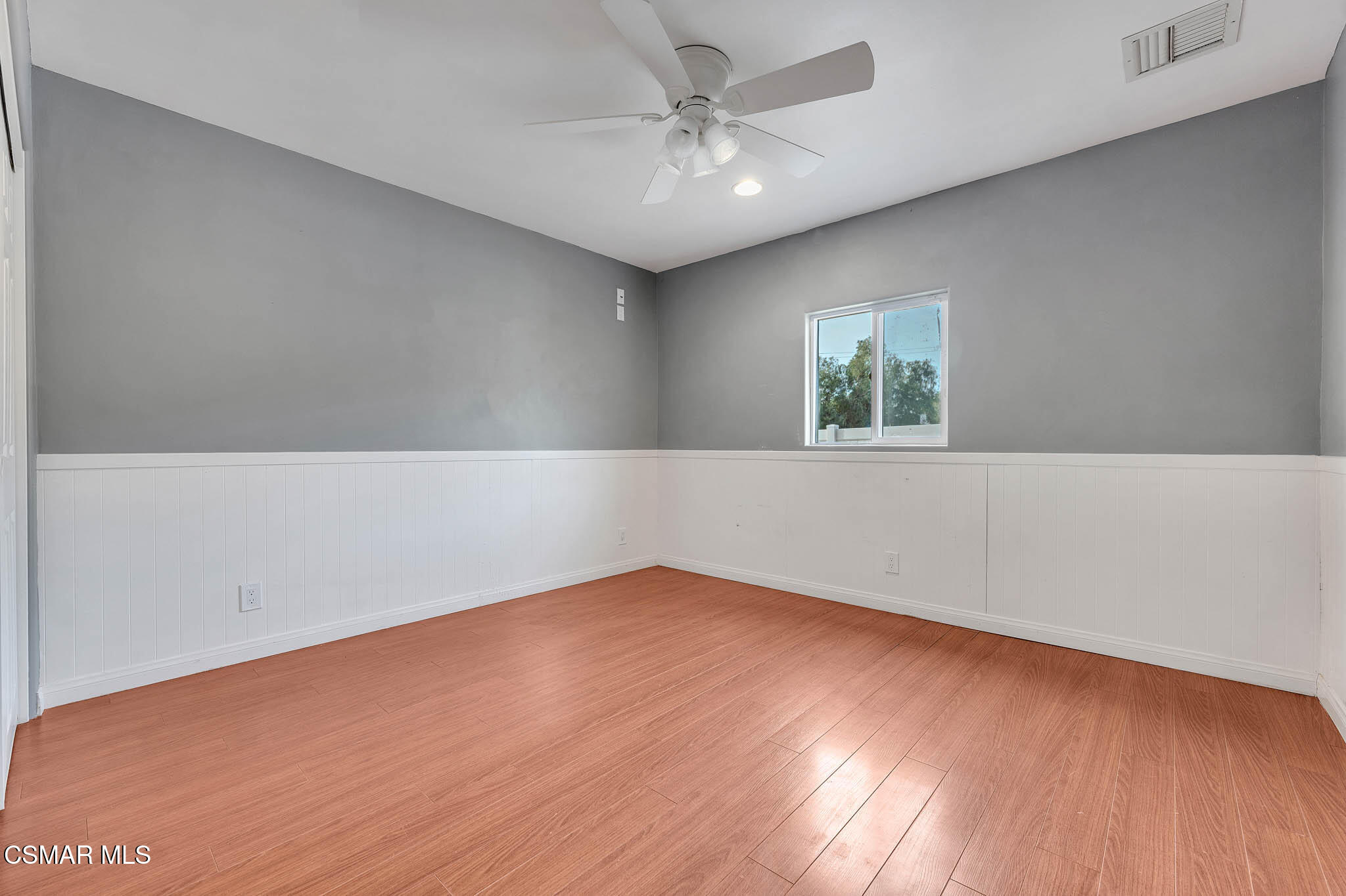 3063 Ditch Road Simi Valley, CA 93063 - Photo 20 of 49 an empty room with wooden floor and windows