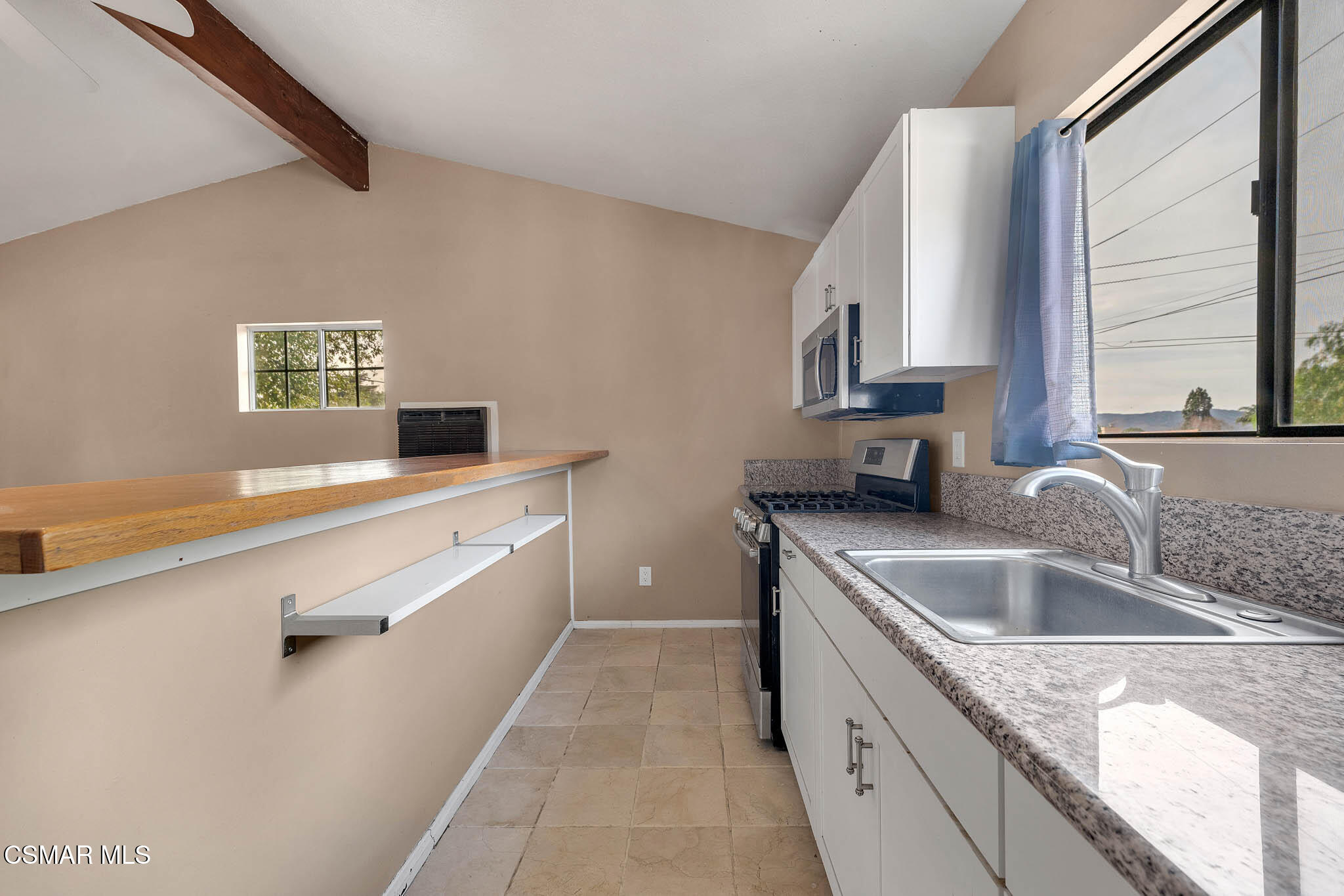 3063 Ditch Road Simi Valley, CA 93063 - Photo 37 of 49 a kitchen with a sink dishwasher a stove and cabinets