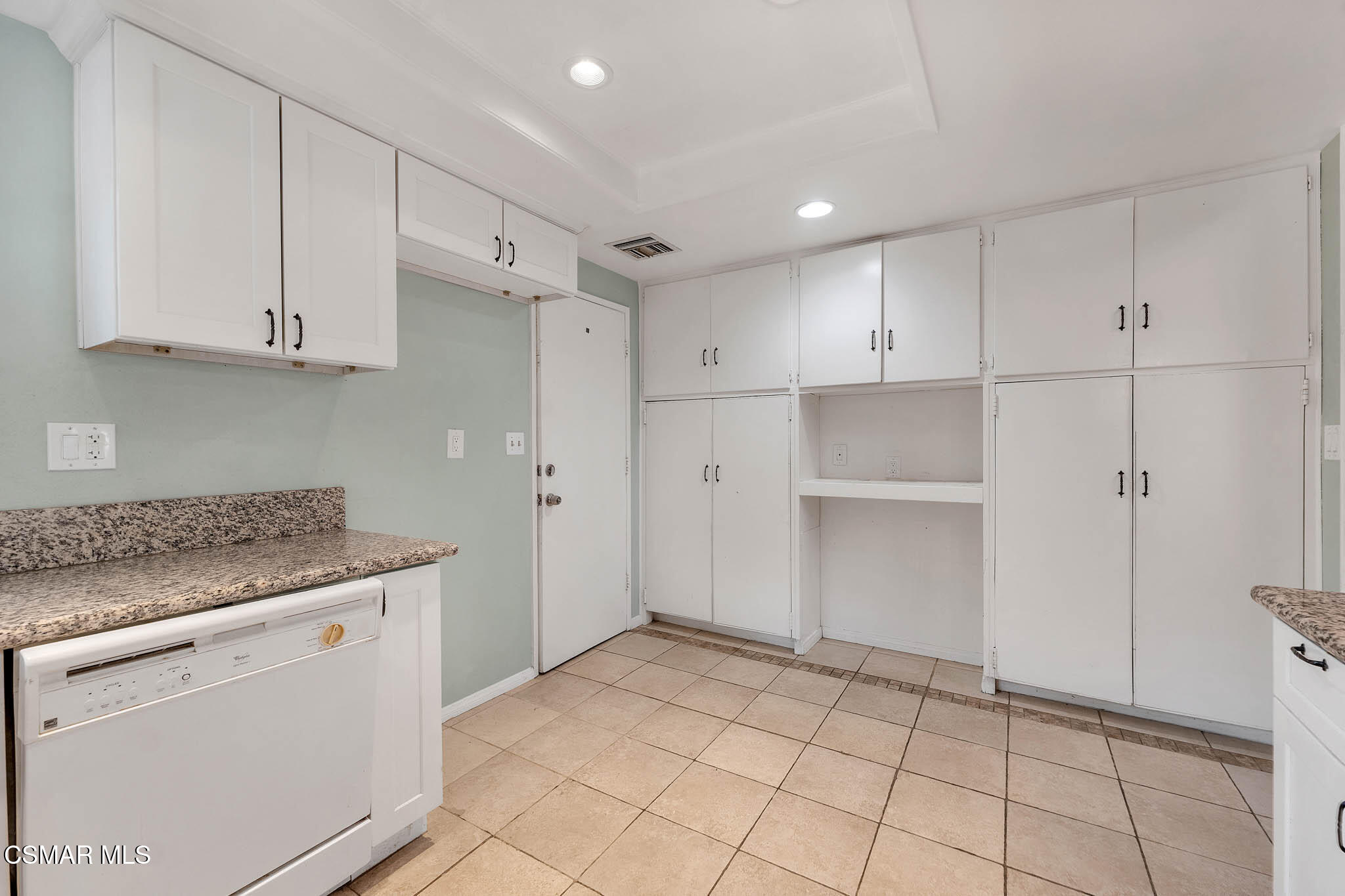 3063 Ditch Road Simi Valley, CA 93063 - Photo 7 of 49 a kitchen with white cabinets and white appliances