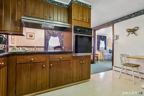 a view of a kitchen with furniture and a kitchen
