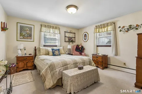a bed room with bed and a window
