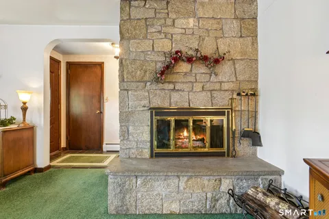 a view of fireplace and front door