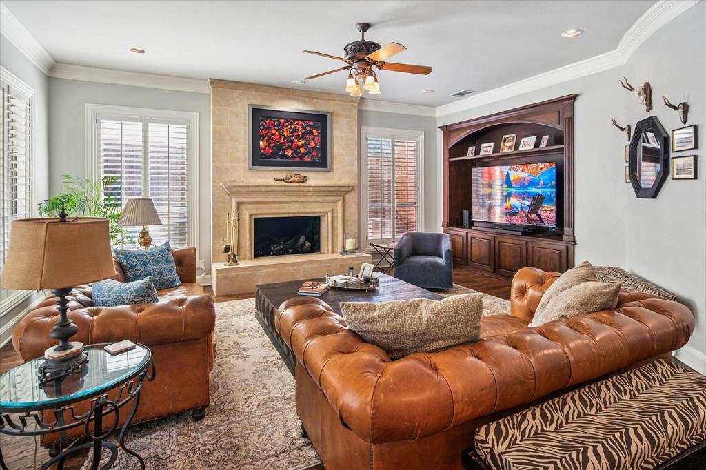 6511 Aberdeen Avenue Dallas, TX 75230 - Photo 11 of 40 a living room with furniture and a fireplace