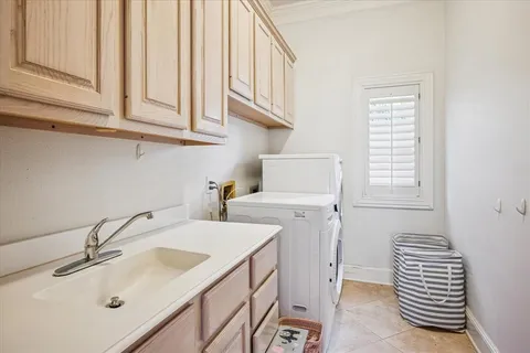a bathroom with a sink and a washing machine