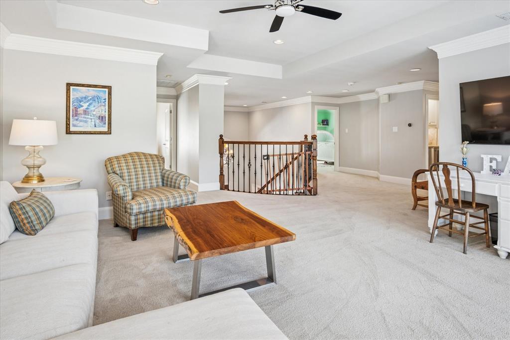 6511 Aberdeen Avenue Dallas, TX 75230 - Photo 26 of 40 a living room with furniture and a flat screen tv