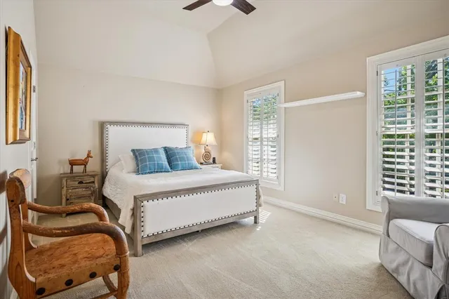 a bedroom with bed and window