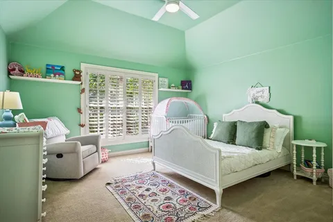 a bed room with a bed and a window