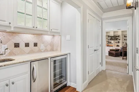 a kitchen with granite countertop a sink and cabinets