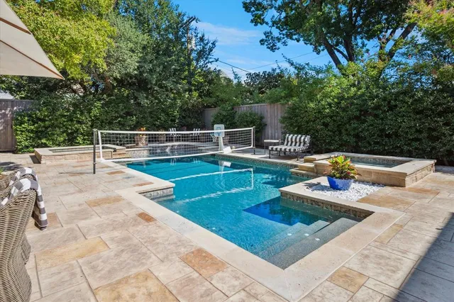a view of swimming pool with chairs