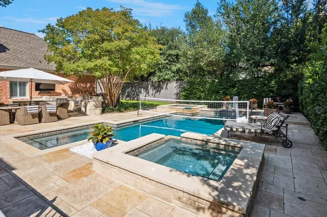 a view of a swimming pool with a patio