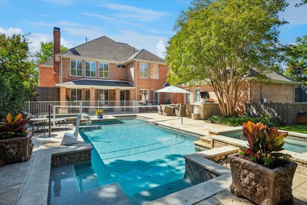 6511 Aberdeen Avenue Dallas, TX 75230 - Photo 37 of 40 a view of a swimming pool with lounge chairs