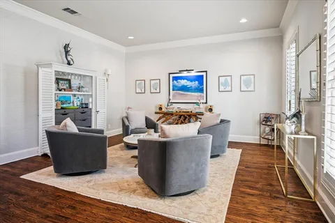 a living room with furniture and a rug