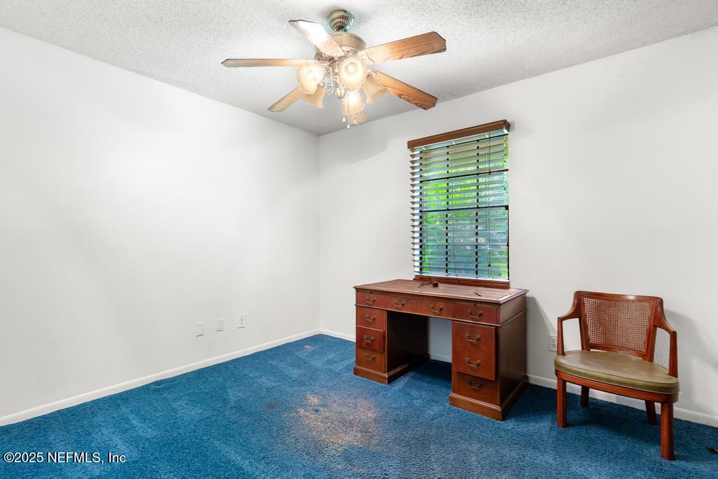 5342 Hickson Road Jacksonville, FL 32207 - Photo 11 of 19 a living room with furniture and a window