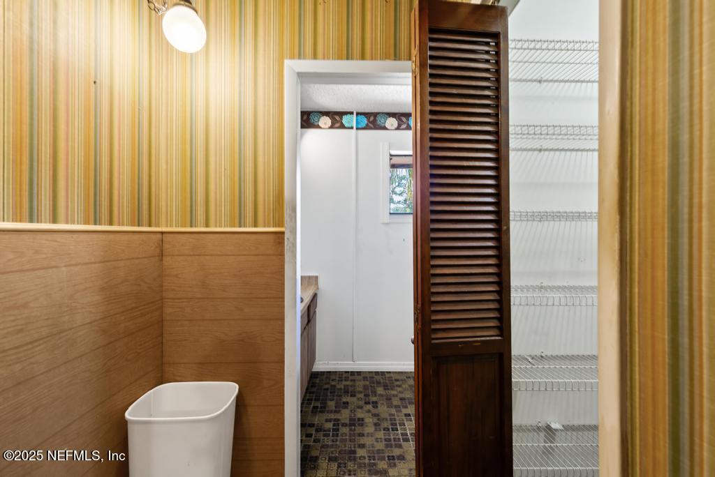 5342 Hickson Road Jacksonville, FL 32207 - Photo 13 of 19 a bathroom with a toilet and a shower