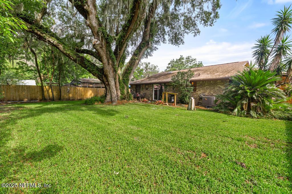 5342 Hickson Road Jacksonville, FL 32207 - Photo 19 of 19 a view of house that has a yard