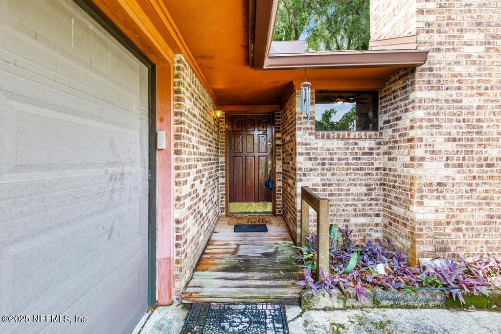 5342 Hickson Road Jacksonville, FL 32207 - Photo 3 of 19 a view of front door of house with stairs