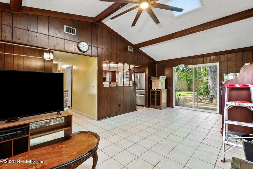 5342 Hickson Road Jacksonville, FL 32207 - Photo 6 of 19 a living room with furniture and a flat screen tv
