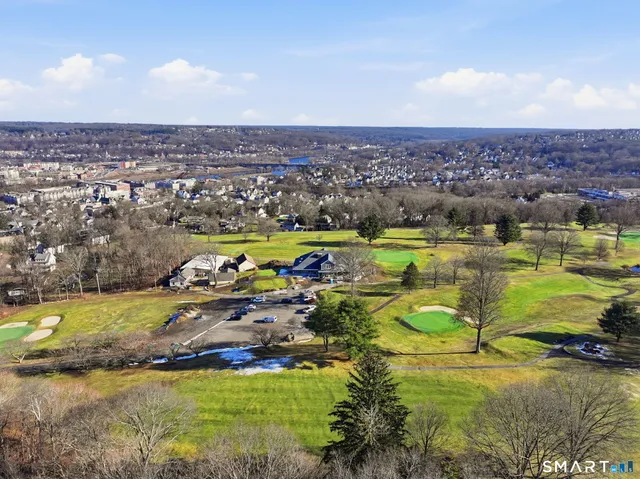 an aerial view of a houses with outdoor space