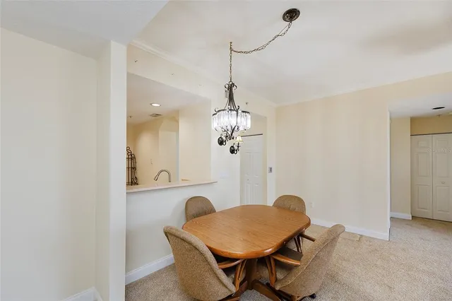 a dining room with a table and chairs