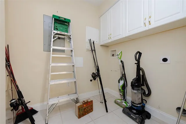 a view of gym equipment with wooden floor