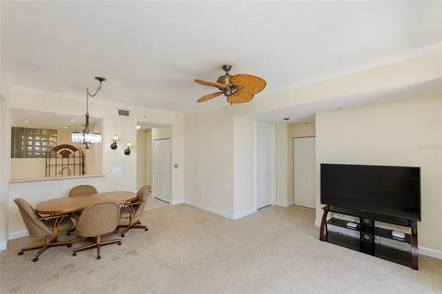 a view of a livingroom with furniture and a flat screen tv