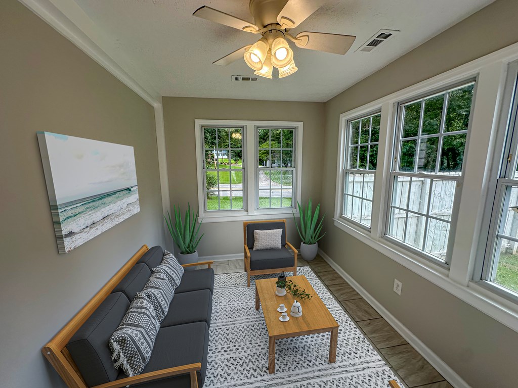 558 Macedonia Road Newnan, GA 30263 - Photo 24 of 44 a living room with furniture and a large window