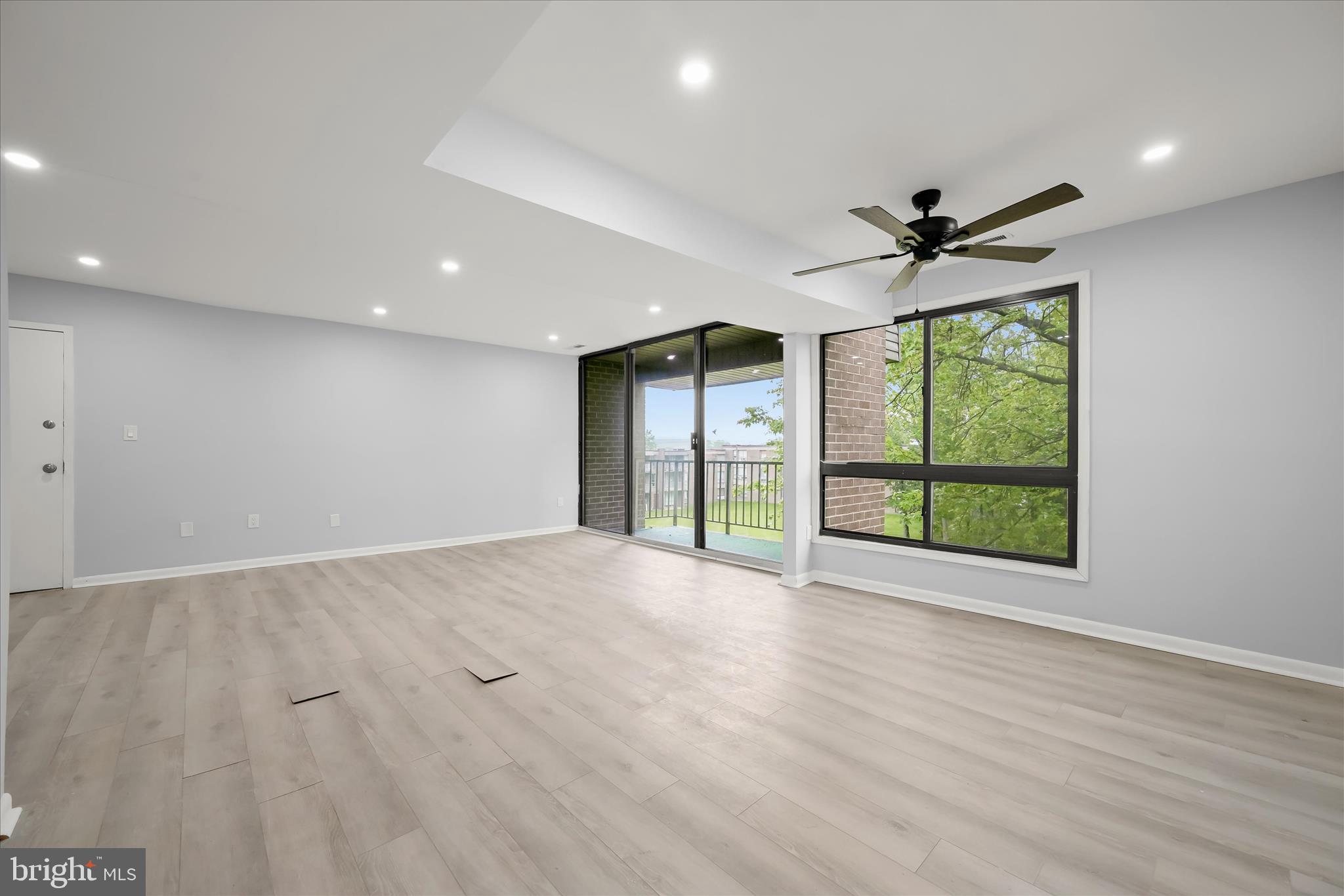 7967 Riggs Road, Unit 796710 Hyattsville, MD 20783 - Photo 11 of 29 Dining - Living - Balcony