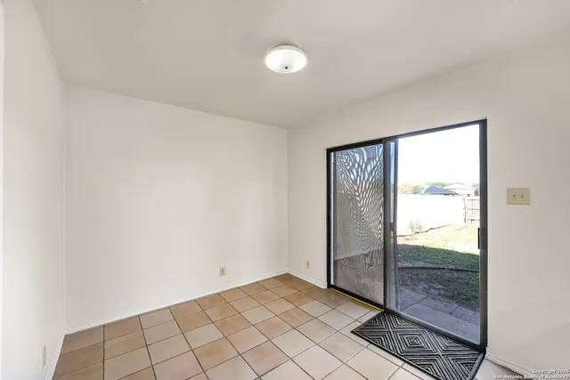 a view of an empty room and window