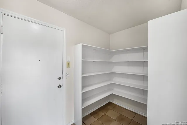 a storage room with washer and dryer