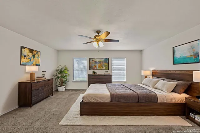 a bedroom with a bed and window