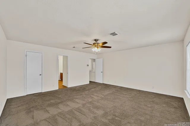 a view of a big room with carpet