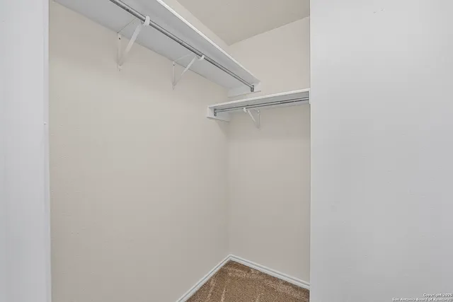 a view of an empty walk in closet