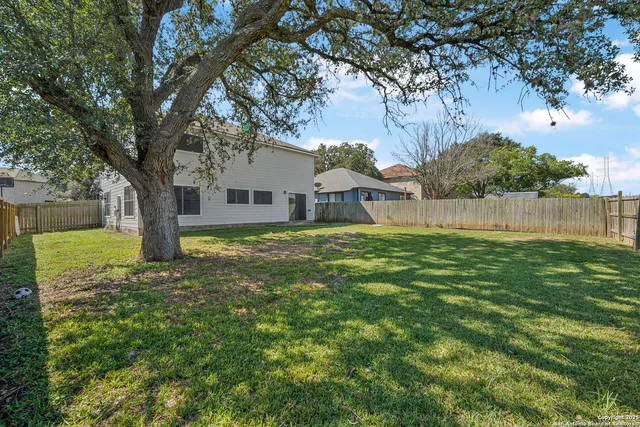 a house view with swimming pool in front of it