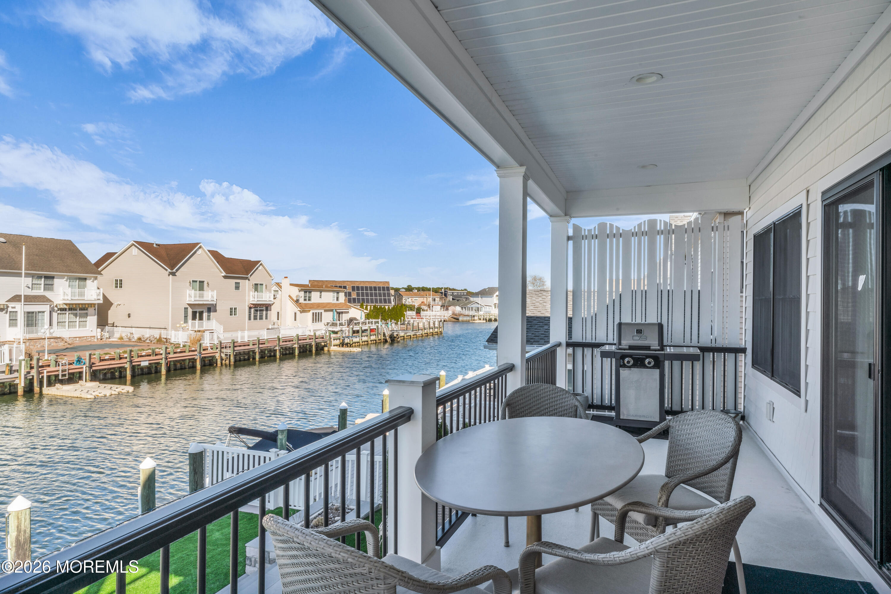 57 Club House Road Brick, NJ 08723 - Photo 18 of 45 a view of a balcony with a table and chairs