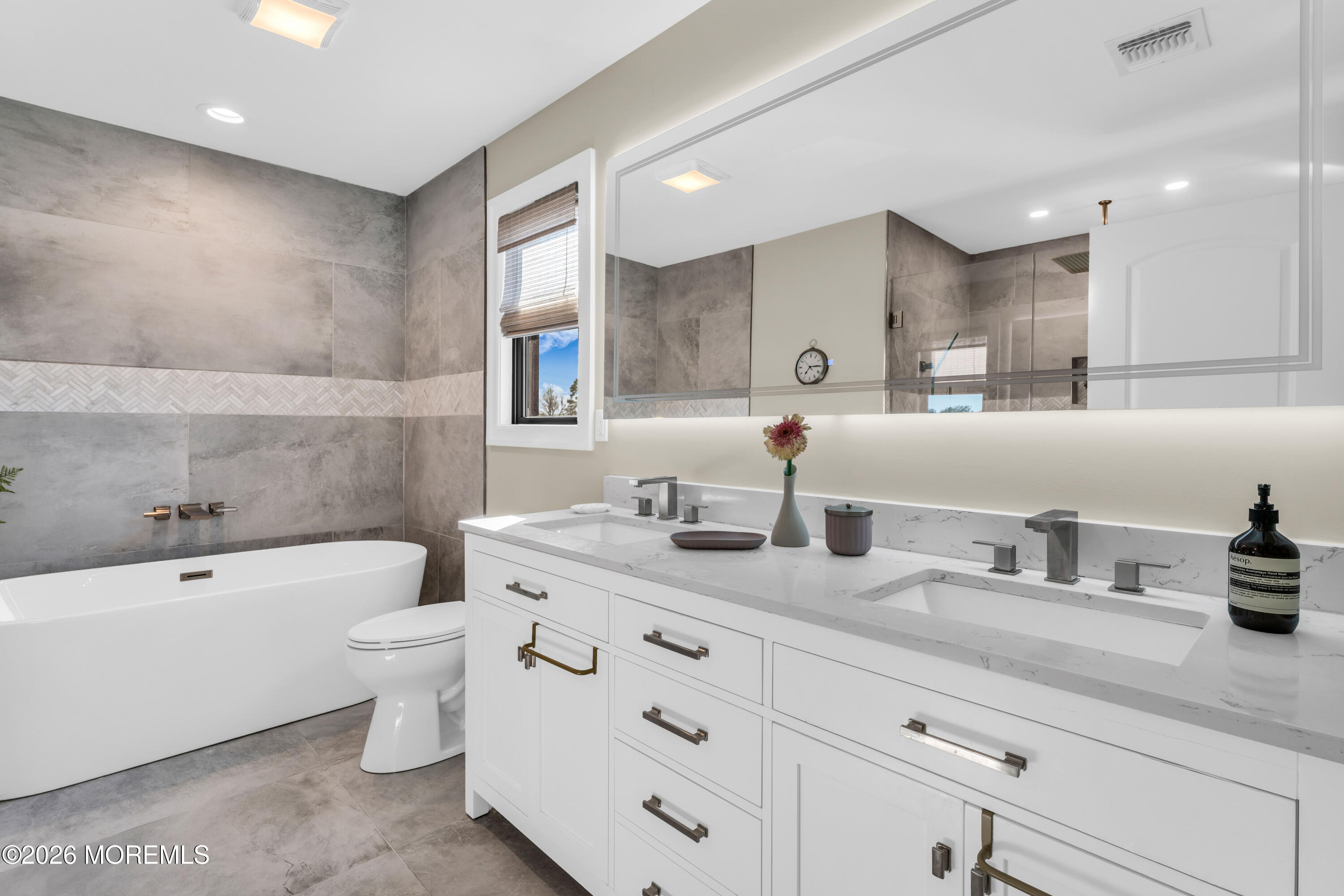 57 Club House Road Brick, NJ 08723 - Photo 25 of 45 a bathroom with a granite countertop sink a toilet a mirror and bathtub