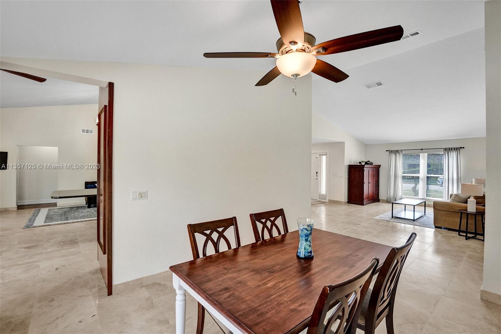 22190 Appleton Drive Boca Raton, FL 33428 - Photo 15 of 41 a dining room with furniture and window