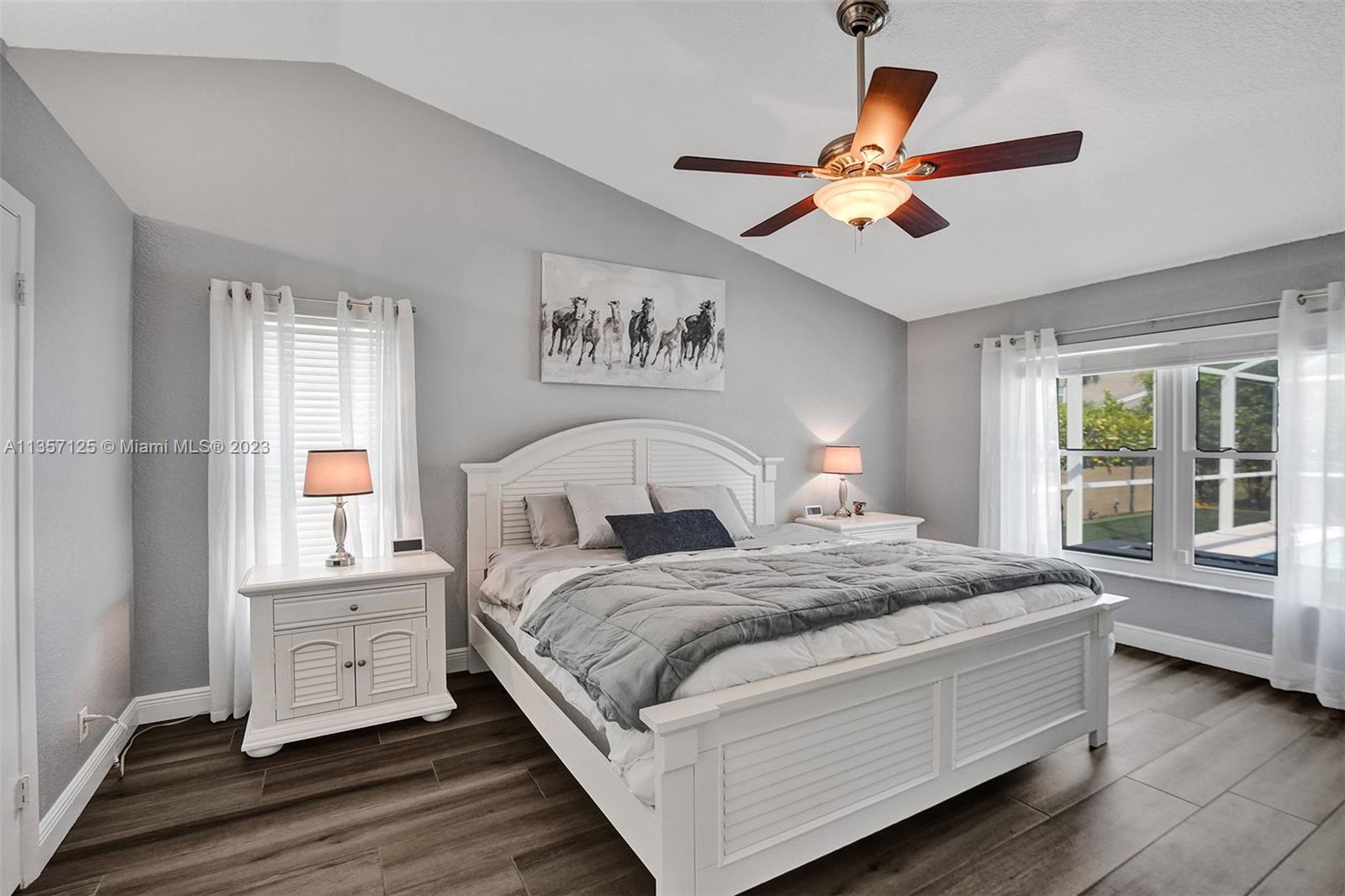 22190 Appleton Drive Boca Raton, FL 33428 - Photo 16 of 41 a bedroom with a large bed and a window