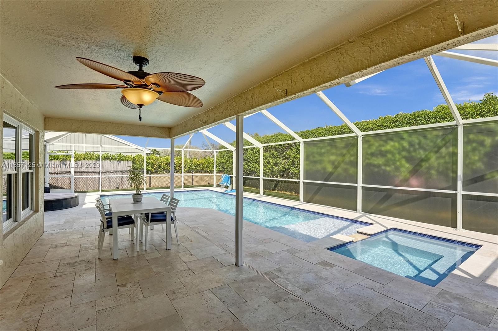 22190 Appleton Drive Boca Raton, FL 33428 - Photo 23 of 41 a view of a dining table and chairs in the patio