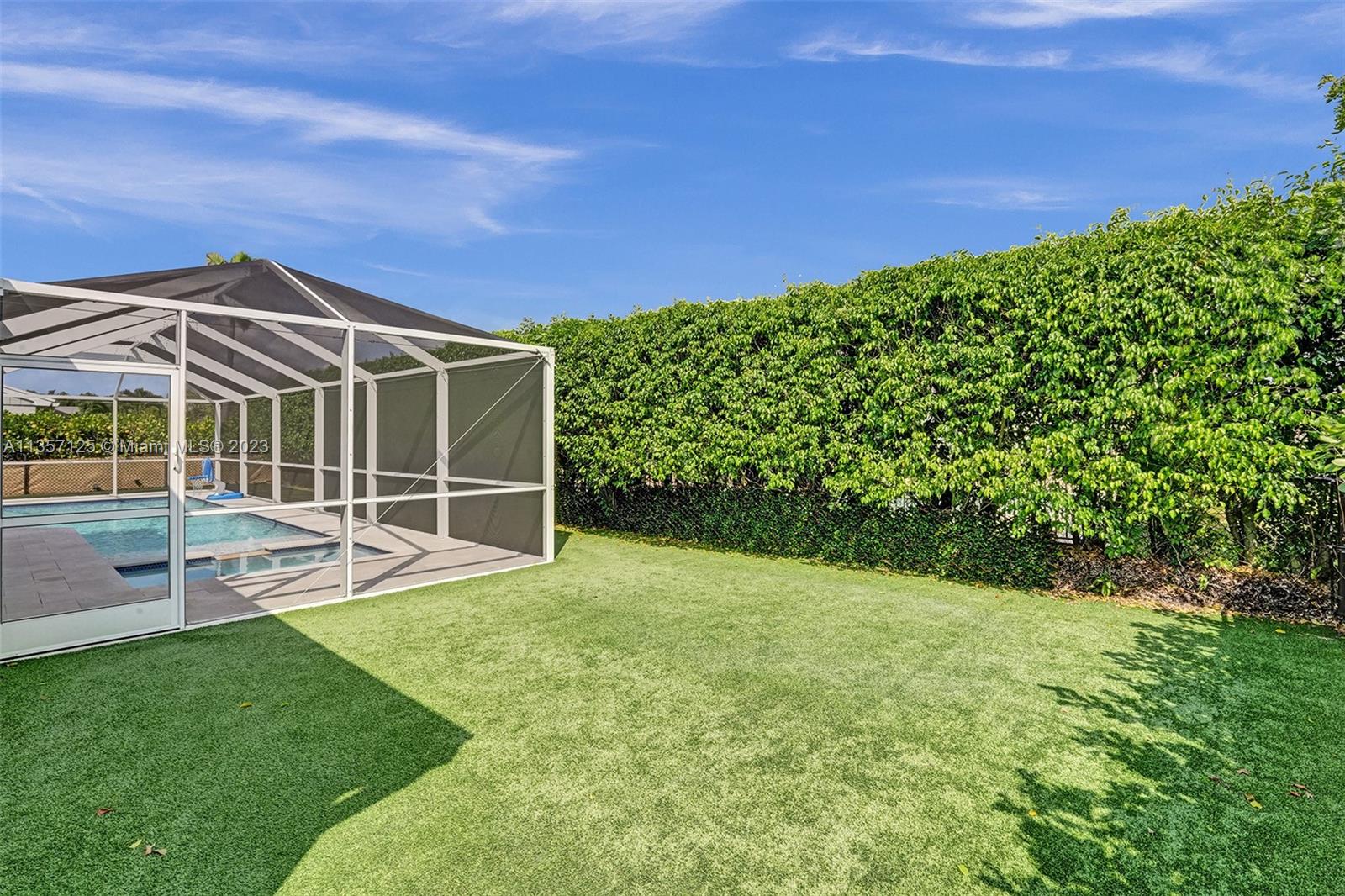 22190 Appleton Drive Boca Raton, FL 33428 - Photo 28 of 41 a view of a garden with a house
