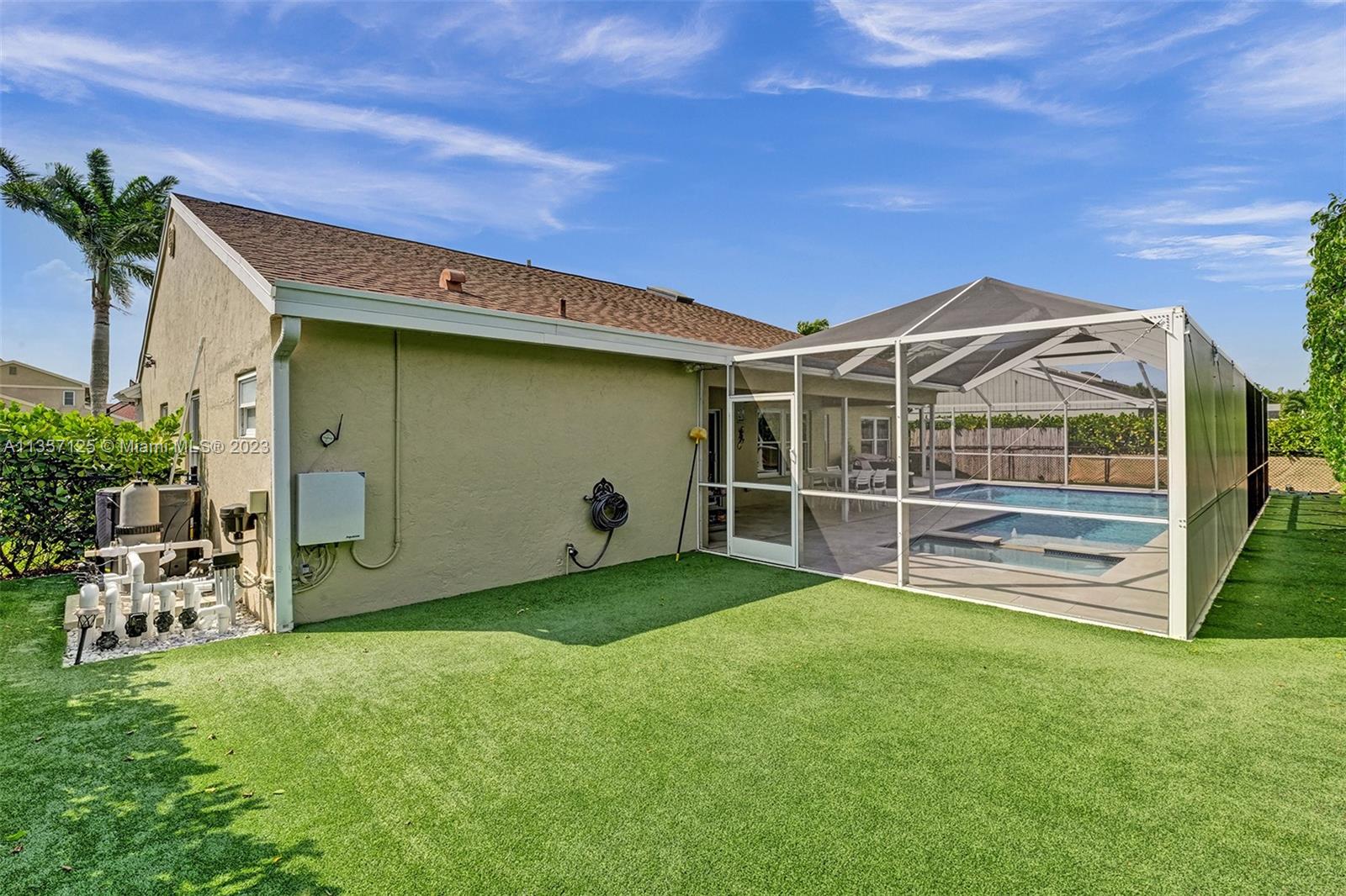 22190 Appleton Drive Boca Raton, FL 33428 - Photo 29 of 41 a view of a chair and table in backyard of the house
