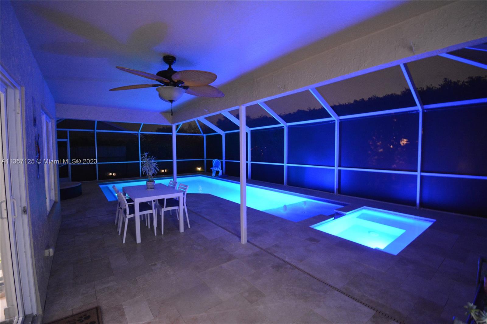 22190 Appleton Drive Boca Raton, FL 33428 - Photo 35 of 41 a view of a room with wooden floor and a table