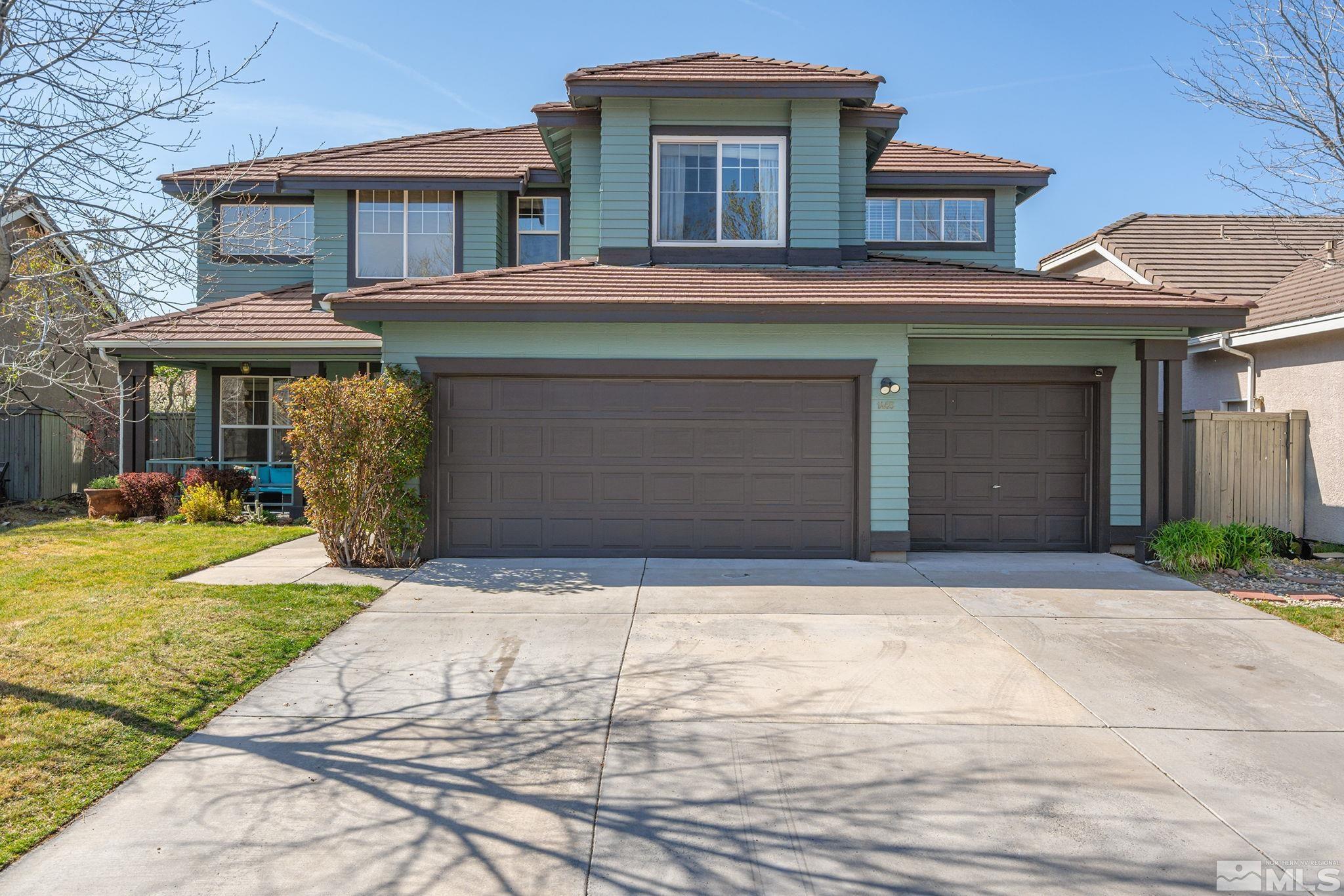 1465 Cayuse Way Reno, NV 89521 - Photo 1 of 26 a front view of a house with garden