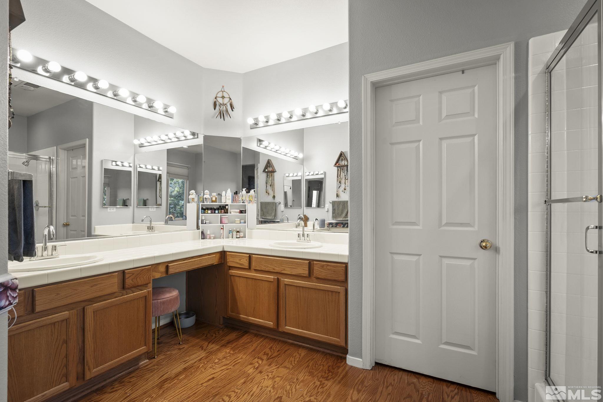 1465 Cayuse Way Reno, NV 89521 - Photo 11 of 26 a kitchen with a sink cabinets and wooden floor
