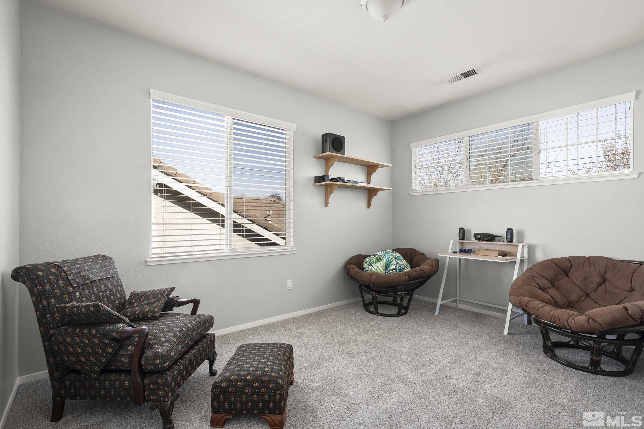 1465 Cayuse Way Reno, NV 89521 - Photo 14 of 26 a living room with furniture and a window