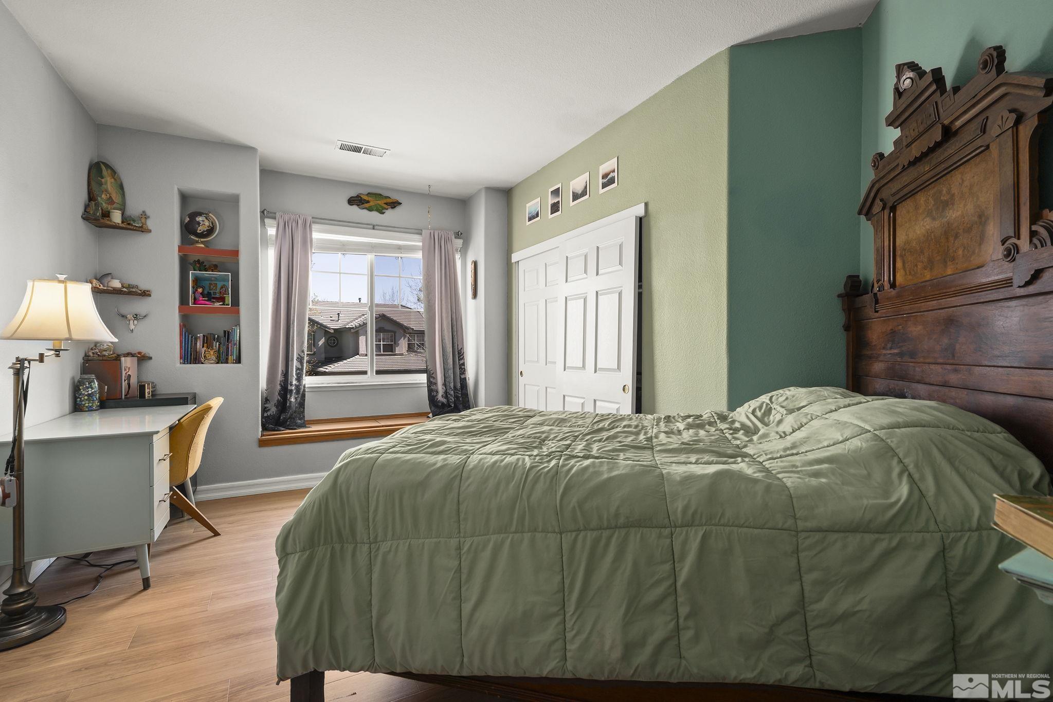 1465 Cayuse Way Reno, NV 89521 - Photo 15 of 26 a bedroom with a bed and window