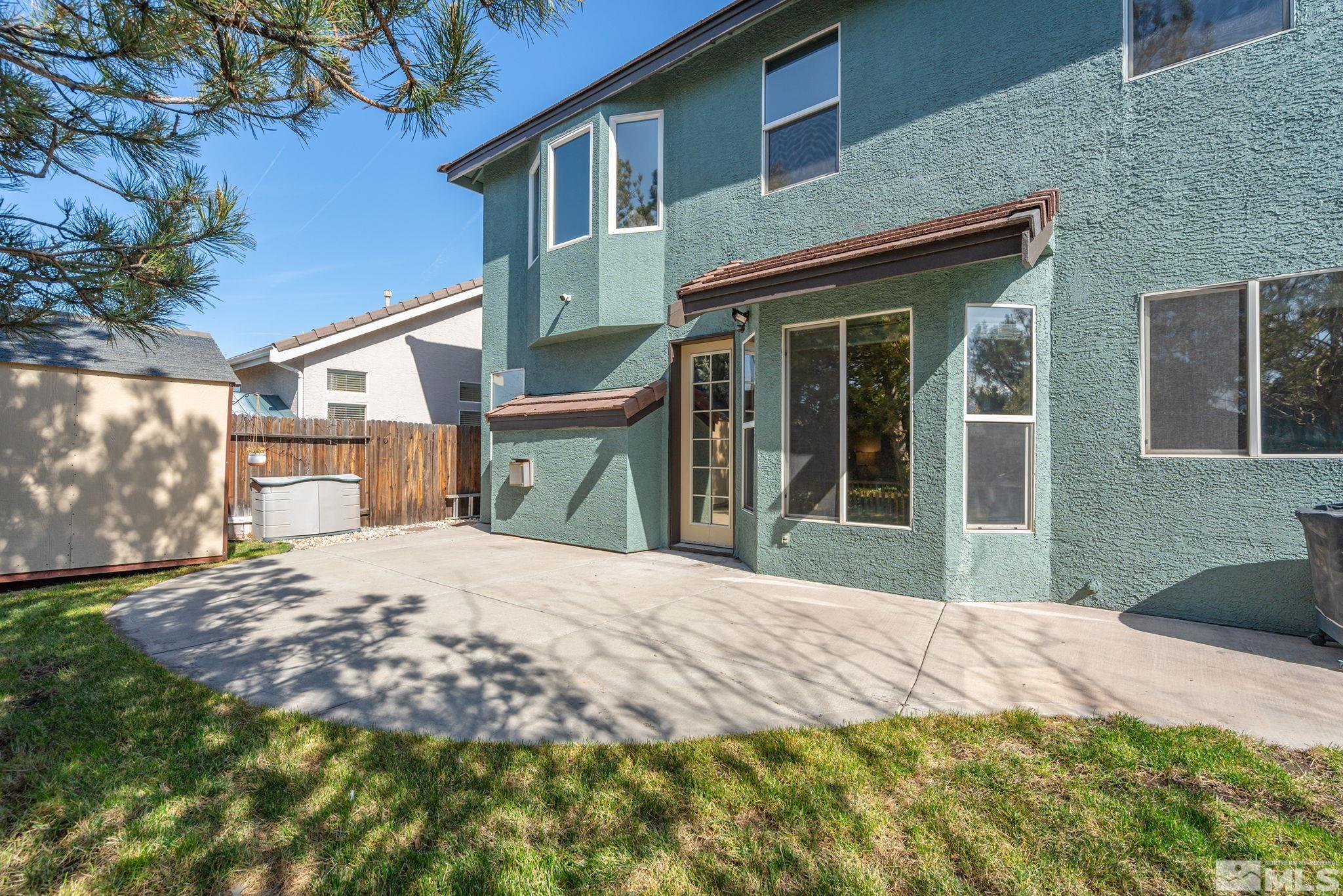 1465 Cayuse Way Reno, NV 89521 - Photo 20 of 26 a front view of a house with a yard