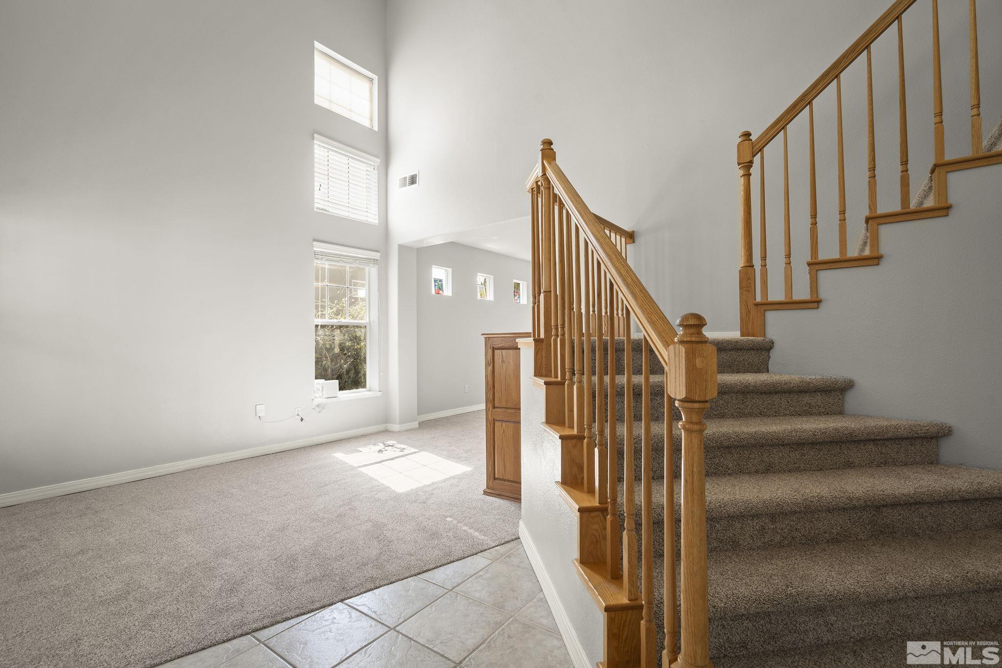 1465 Cayuse Way Reno, NV 89521 - Photo 2 of 26 a view of staircase with wooden floor and stairs