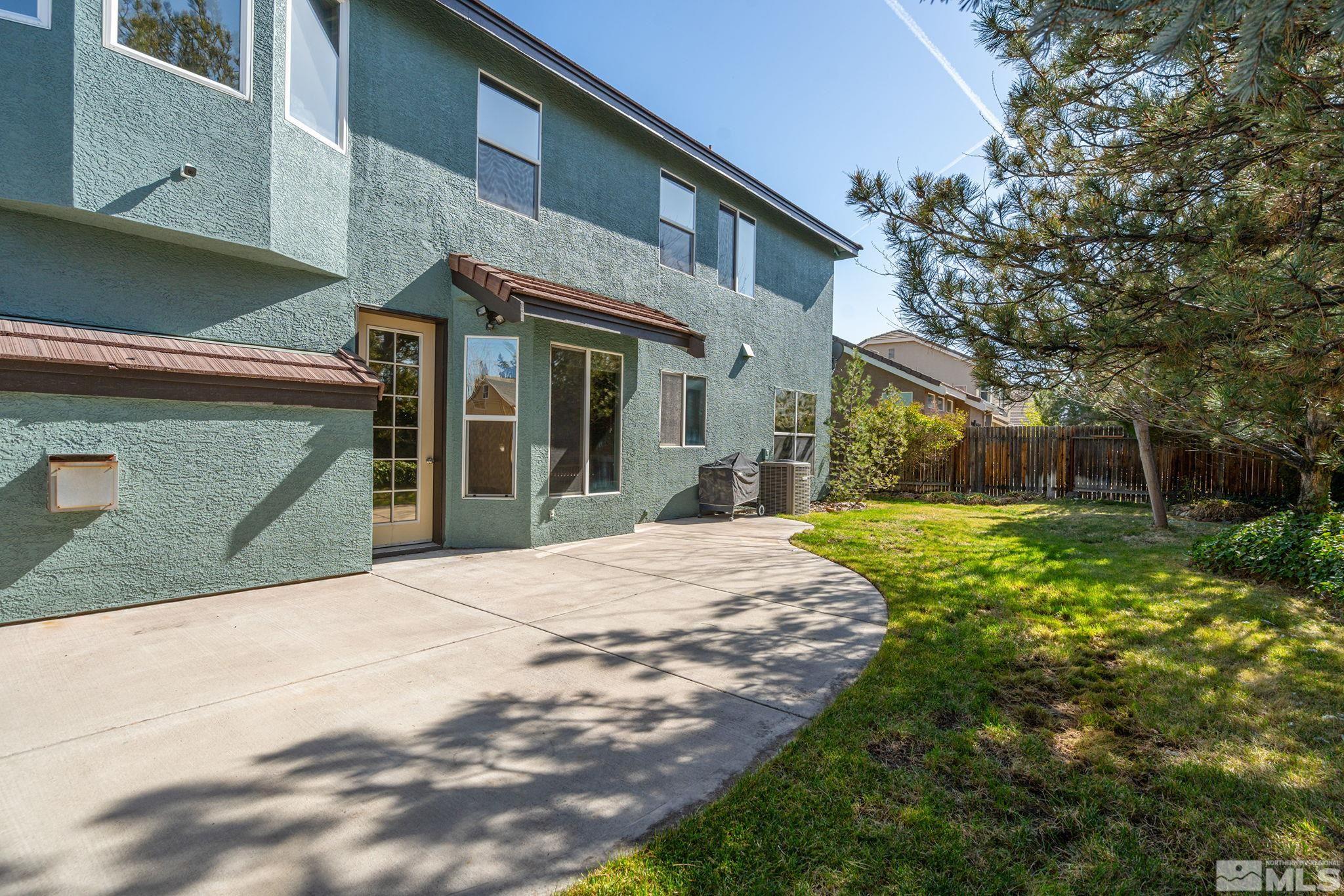 1465 Cayuse Way Reno, NV 89521 - Photo 21 of 26 a front view of a house with garden