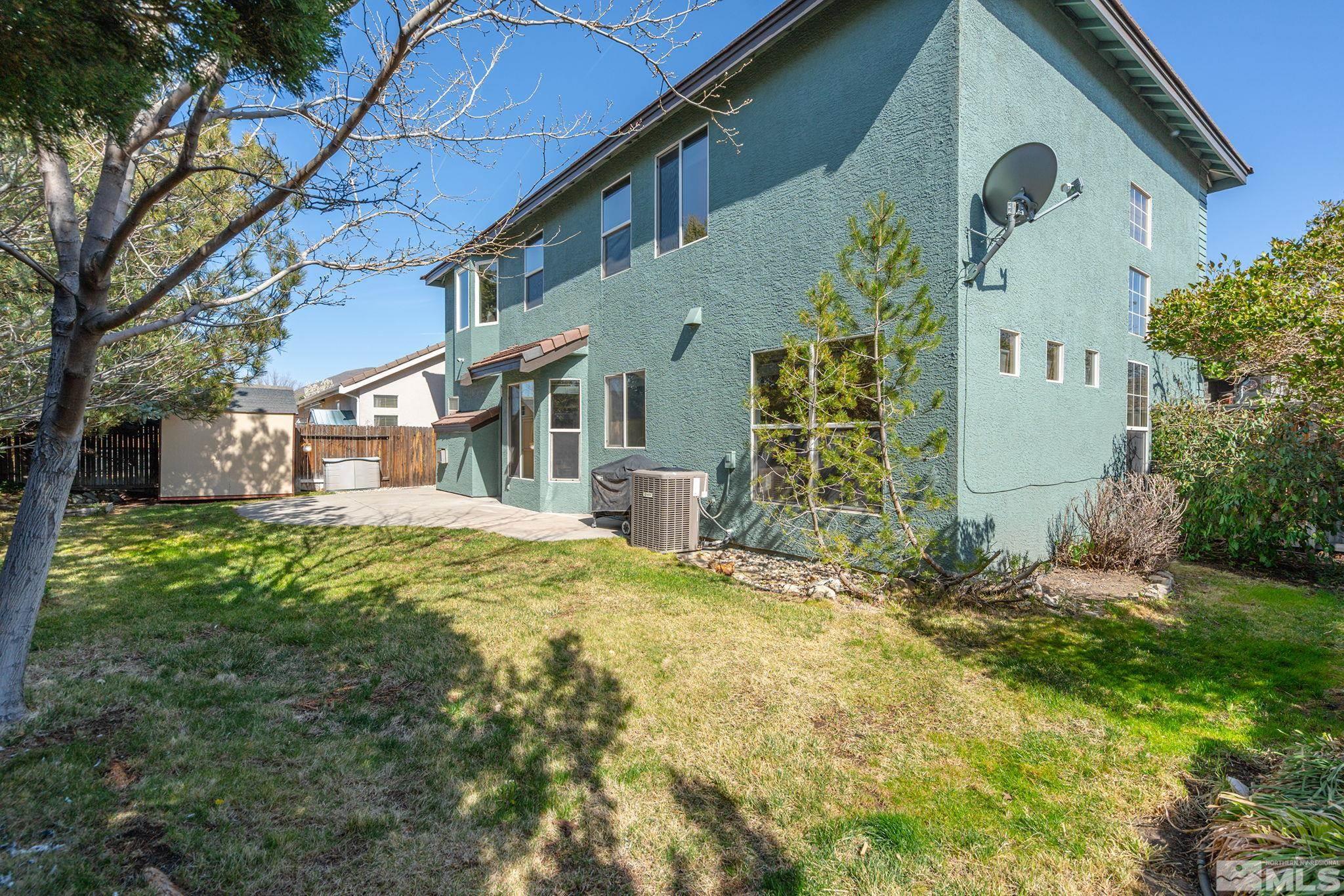 1465 Cayuse Way Reno, NV 89521 - Photo 22 of 26 a view of a house with a yard